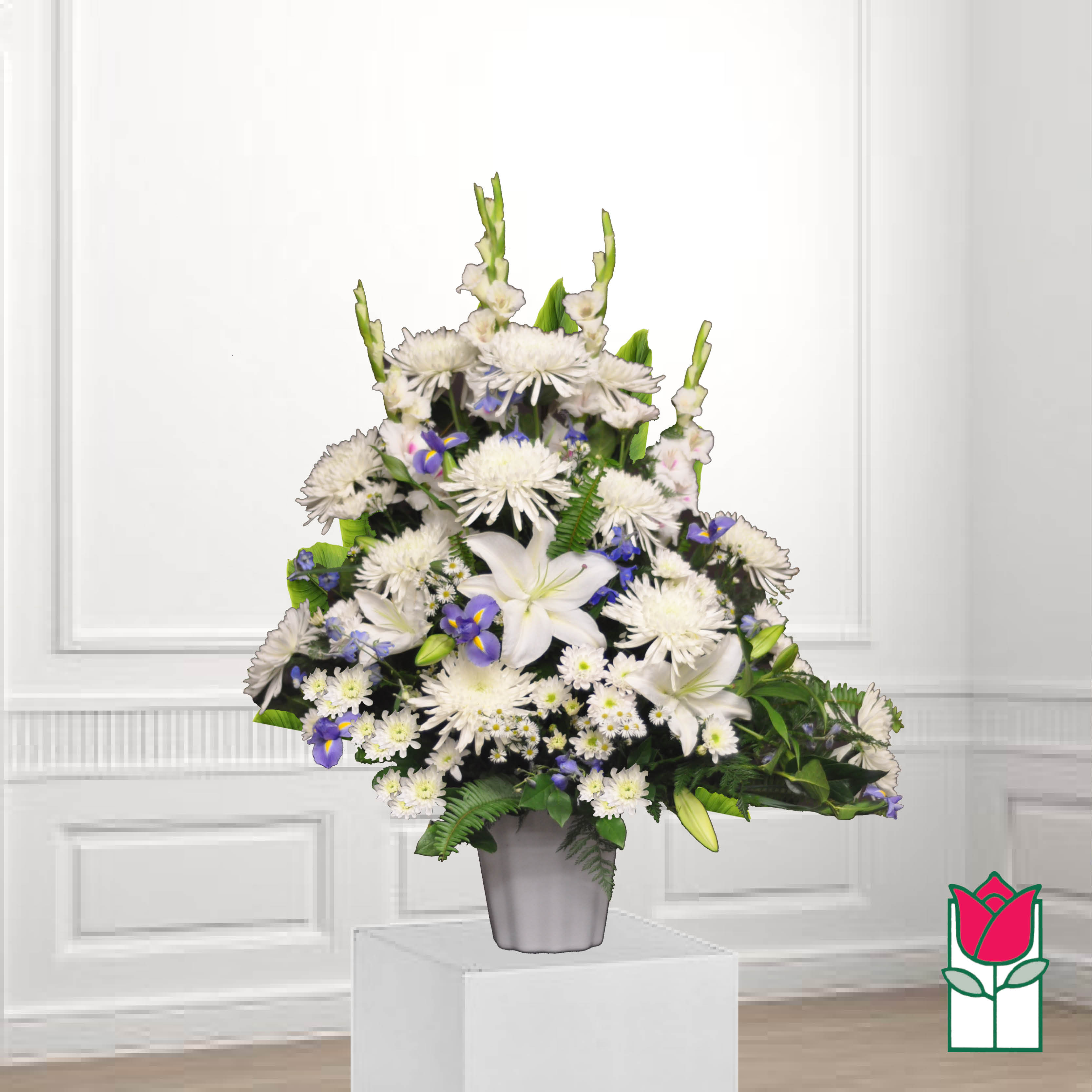 White and purple floral arrangement in a gray vase
