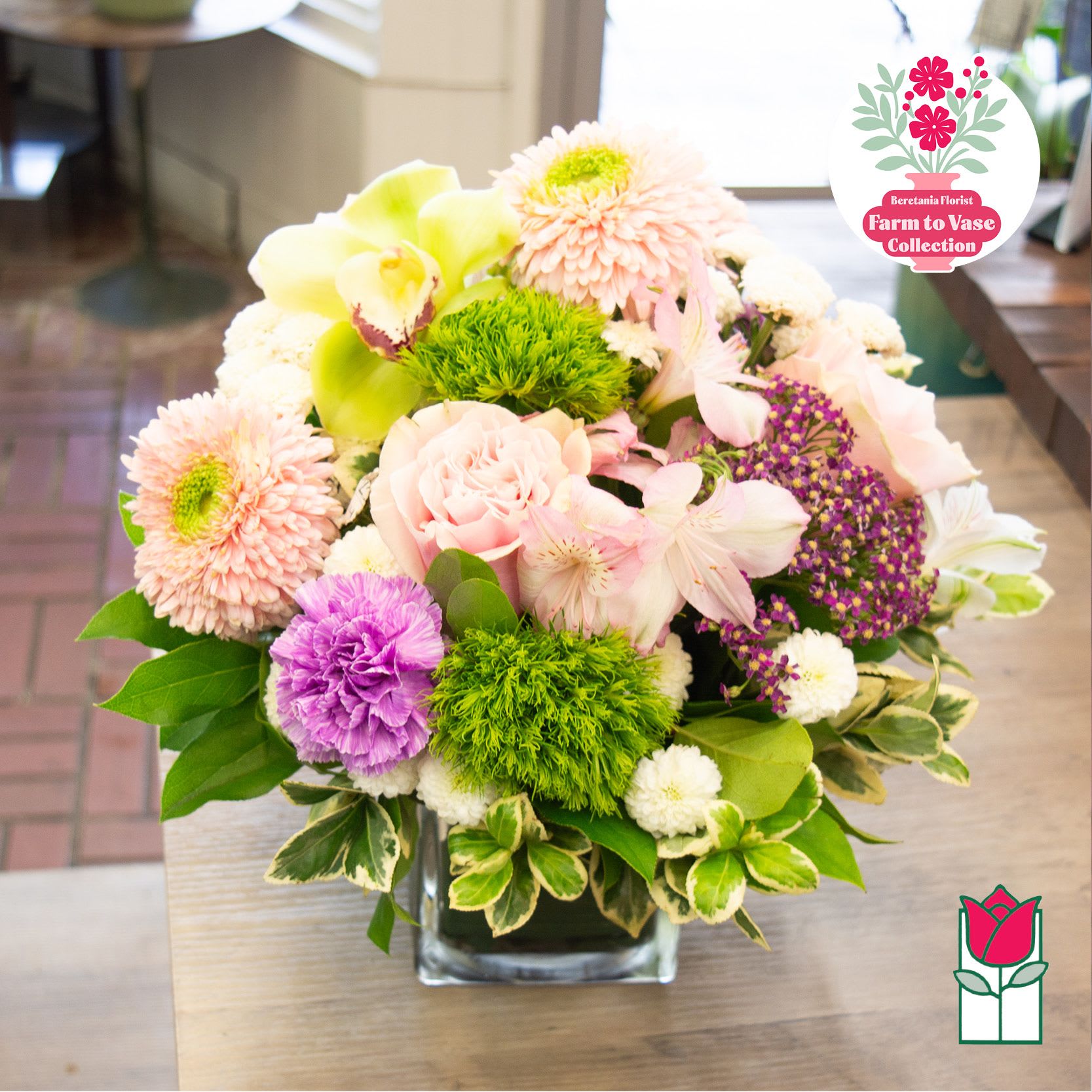 Mixed pastel bouquet in a square glass vase