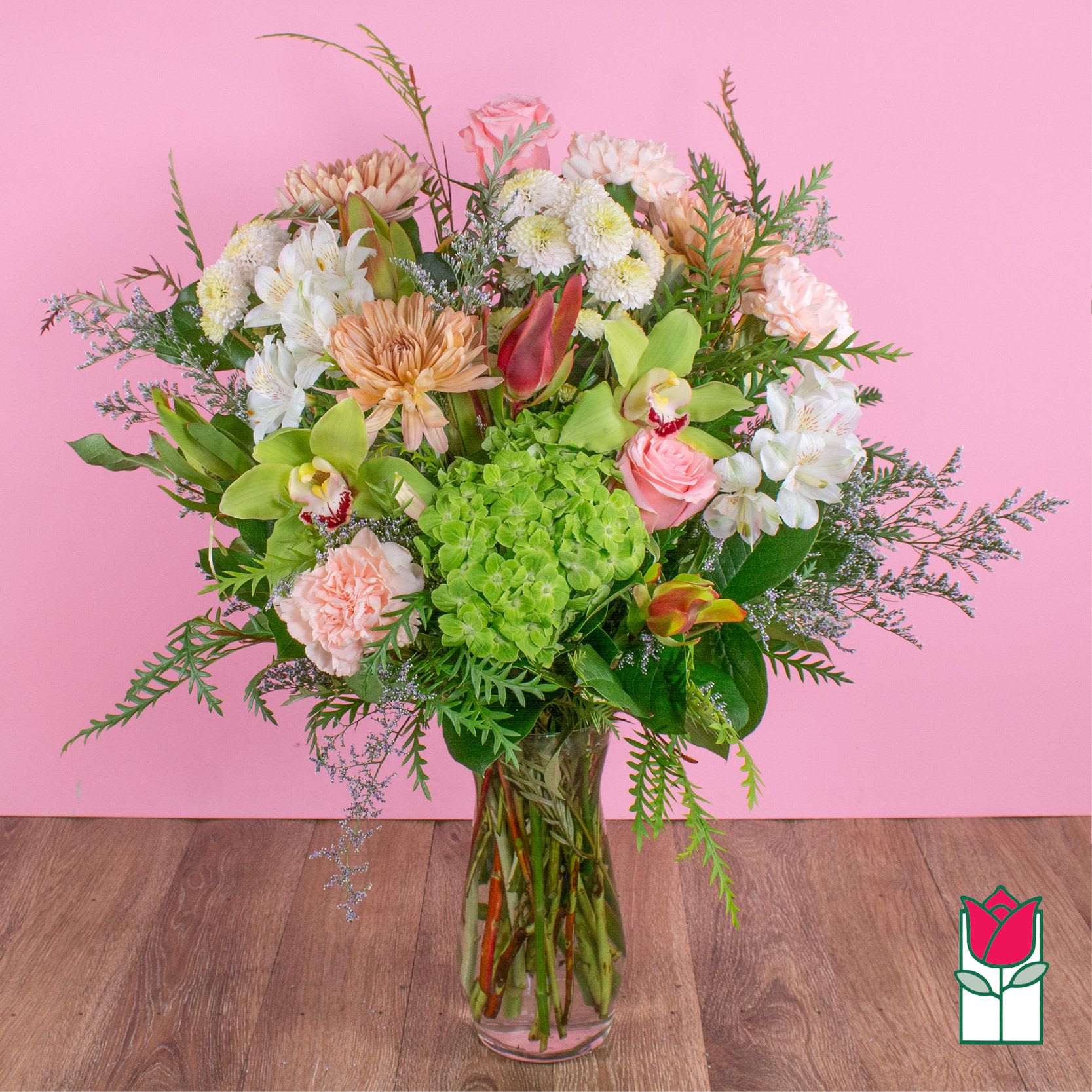 Beretania's Harmony Bouquet (Seasonal Varieties Vary) - Approx. size: 14" High x 10" Wide Size category: Medium Size, perfect for a desk  For this special time of the year, nothing but the best will do. Here at Beretania Florist we specialize in beautiful premium flowers and unbeatable freshness. This bouquet is full of fresh garden spring flower with a combination of our staff's favorites. This bouquet comes in a clear glass vase and includes a custom card message, provided by you!   