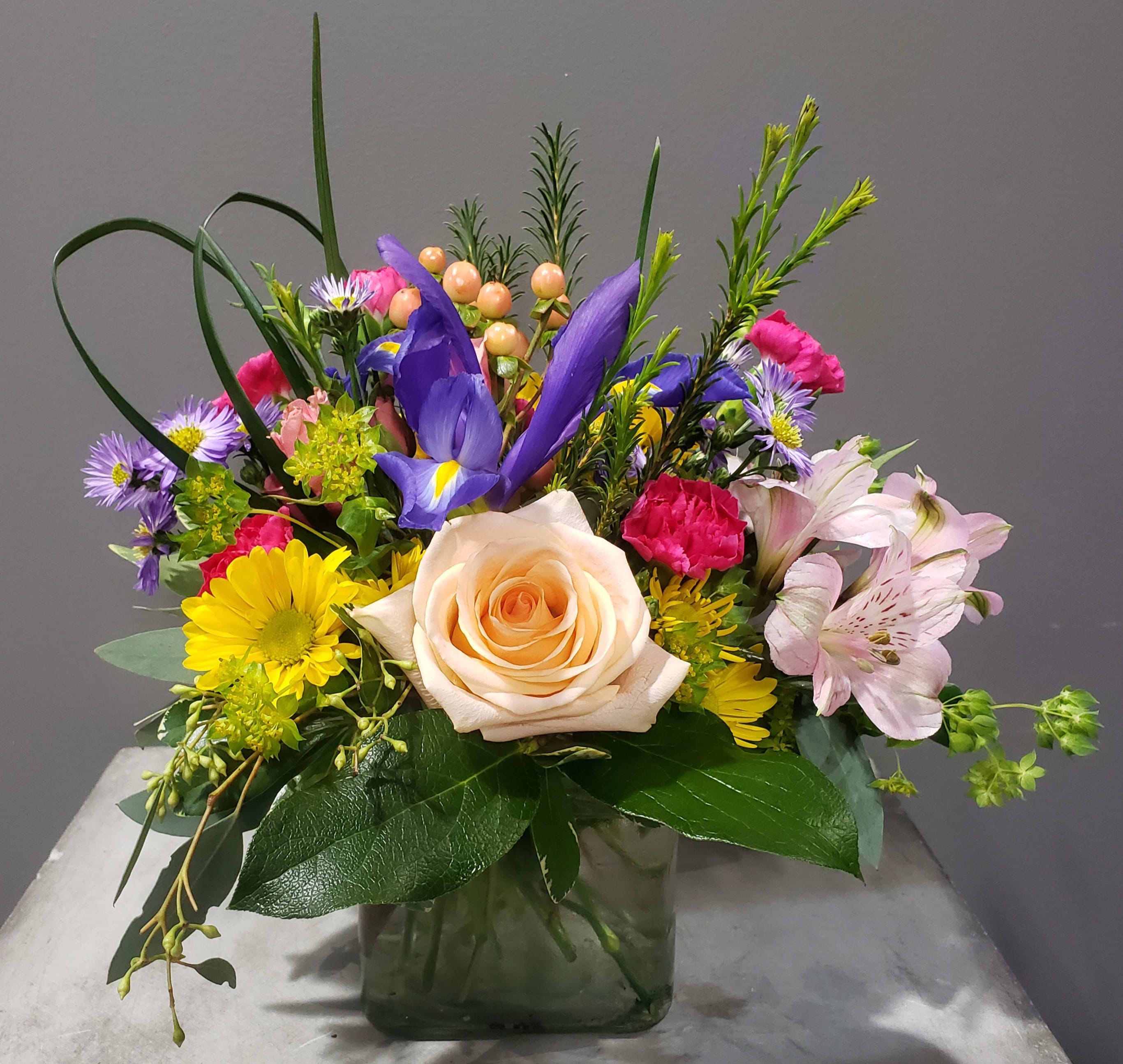Charmer - This charming arrangement is bright and inviting for any occasion! Send someone some charm today!