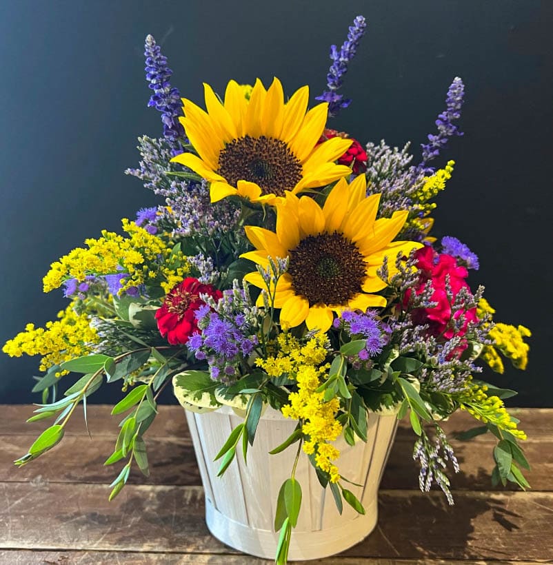 Basket of Sunshine - A delightful basket of farm fresh flowers. Including sunflowers, solidago, zinnias and seasonal flowers.