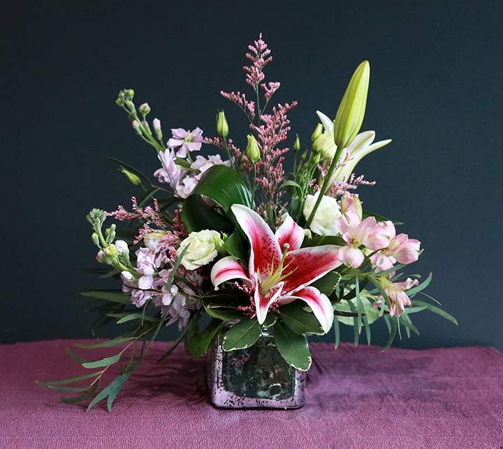 Superstar  - Mom's the Superstar this Mother's Day! Celebrate the amazing woman who shines brighter than any star with the aptly named "Superstar" bouquet.  This shorter arrangement in a silver speckled vase features breathtaking Stargazer lilies, known for their star-shaped blooms and intoxicating fragrance, and is a guaranteed showstopper. It's a dazzling display of affection that will leave her feeling like the true star she is.