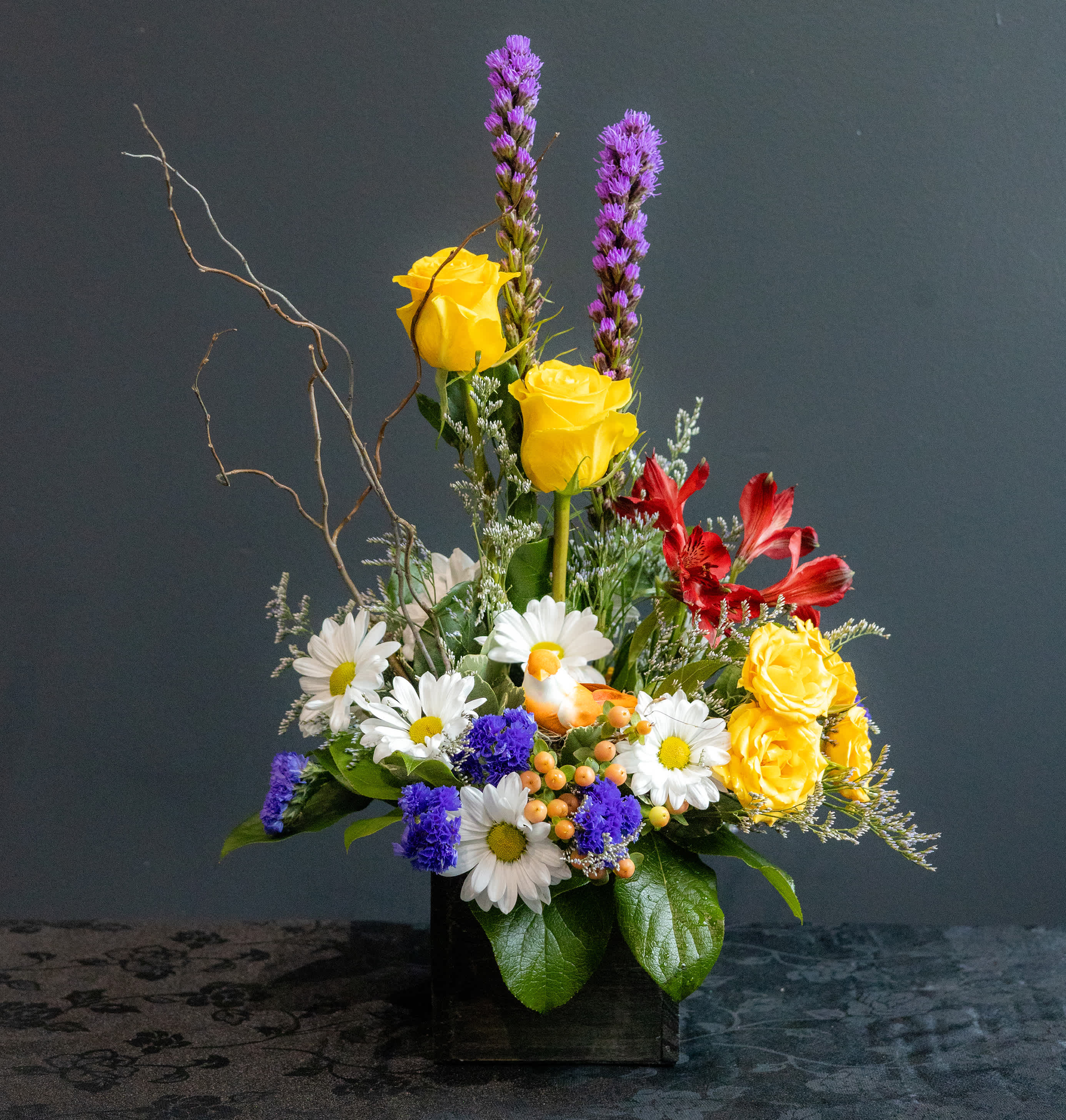 Lil Bird's Sweet Melody - A colorful spring arrangement that brings the colors and freshness of spring flowers to everyone!