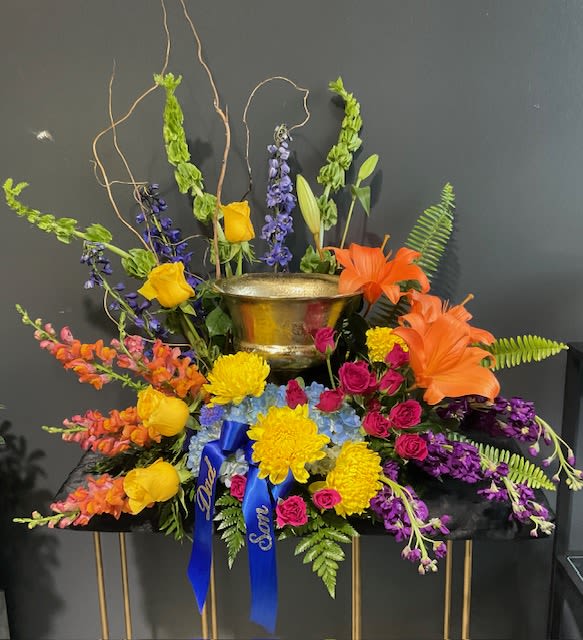 Colorful Urn Arrangement - A colorful floral urn to commemorate the loss of a loved one.