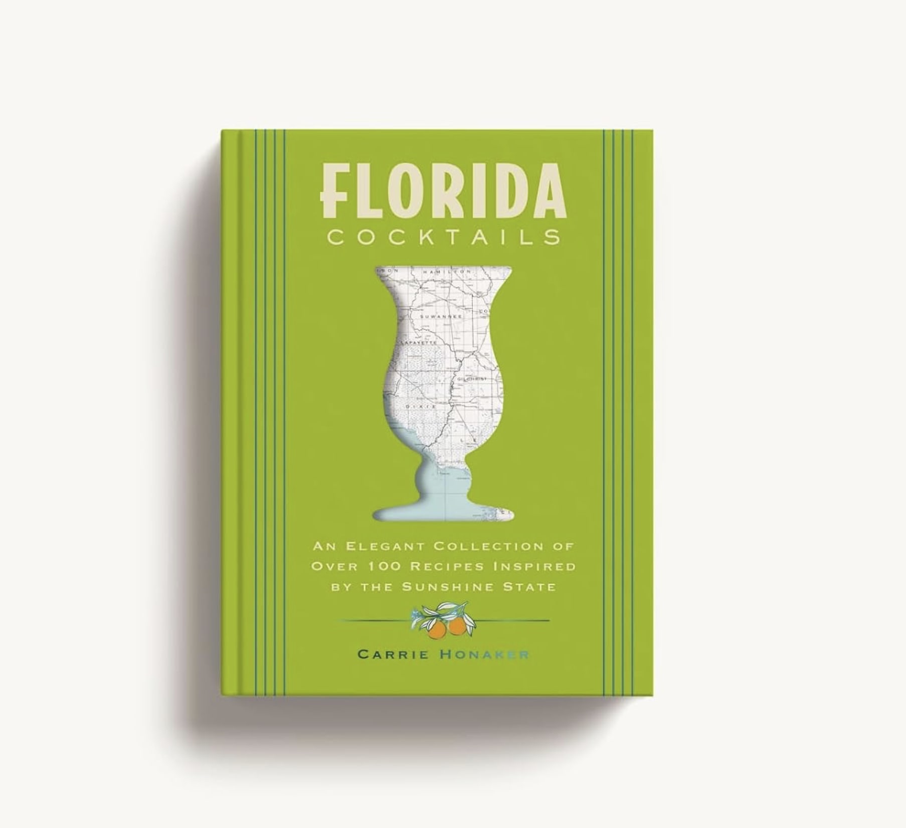 Green cookbook titled Florida Cocktails with a map-shaped glass illustration