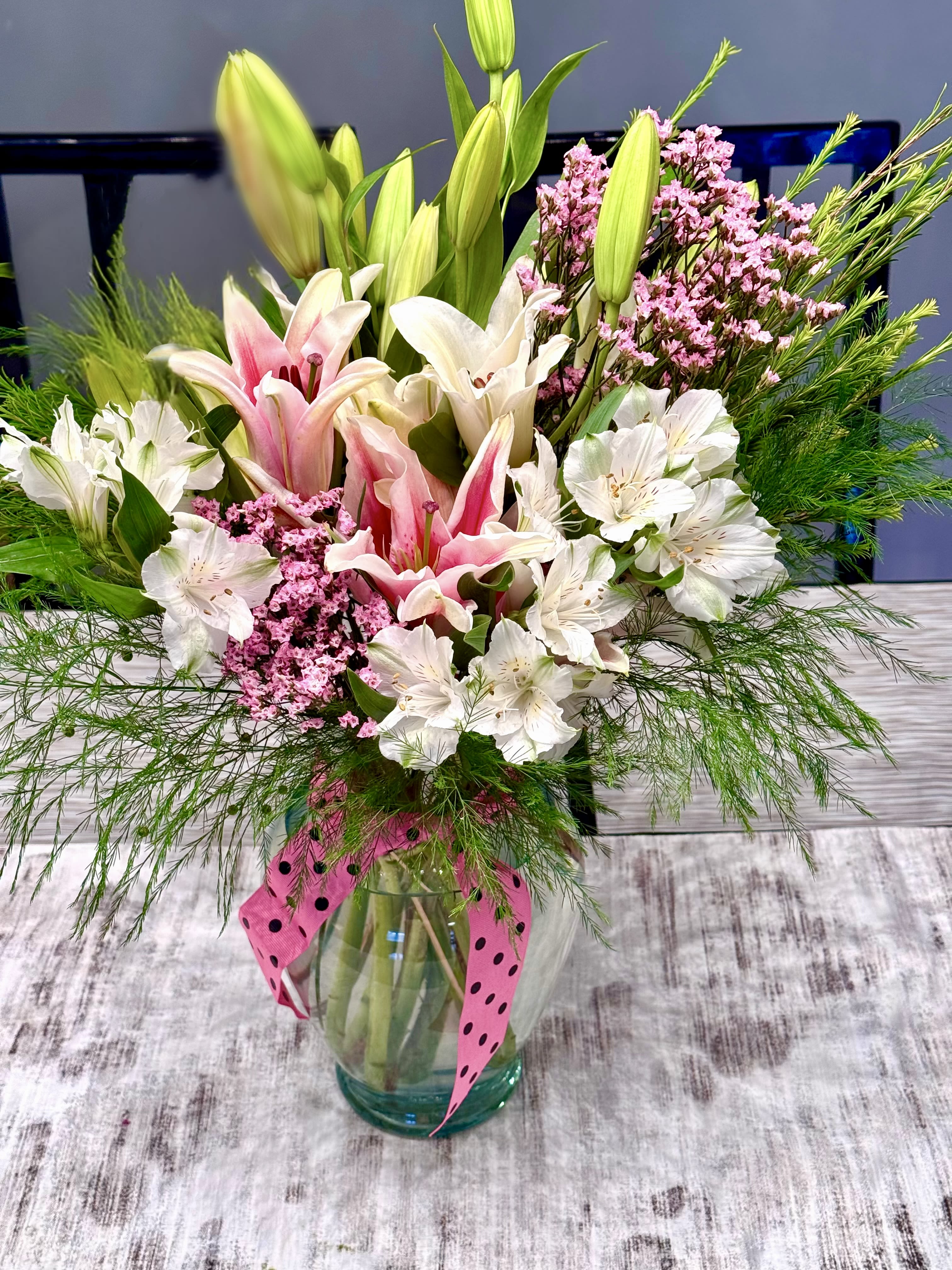 Big Bouquet - The bouquet features premium flowers in various shades, each carefully chosen for its impeccable quality and lush bloom. The classic beauty of lilies is complemented by the graceful presence of alstroemeria, adding a touch of sophistication and purity to the arrangement. Perfect for expressing love, admiration, or congratulations, the Big Bouquet Arrangement is a sophisticated choice for those seeking a truly extraordinary floral experience. Elevate your special moments with this breathtaking bouquet – order now for a premium floral indulgence.  Height 19 in Width 18 in