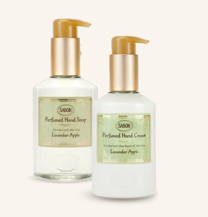 Two pump bottles of lavender apple hand soap and cream