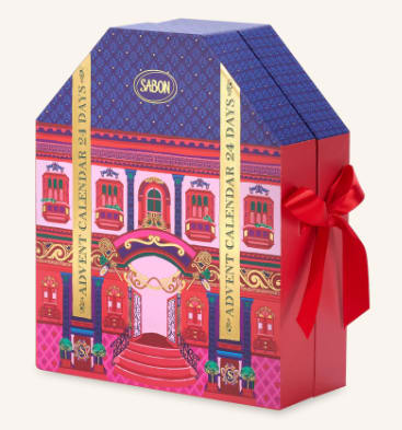 Decorative gift box with a red ribbon and colorful building illustration