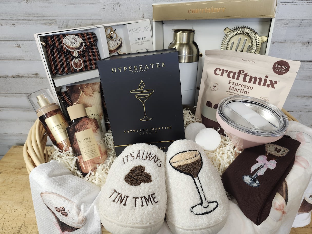 Gift basket with cocktail mix, tumblers, socks, and accessories