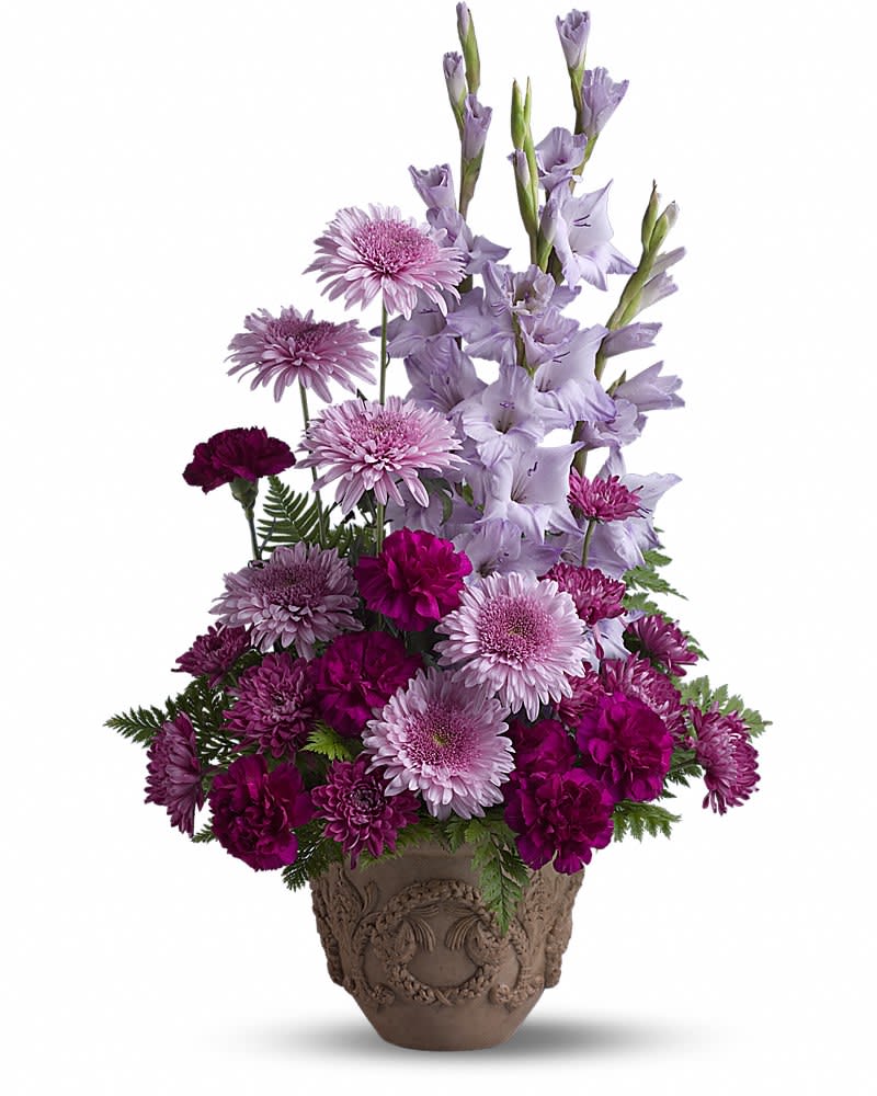 Purple and lavender flowers arranged in a decorative pot