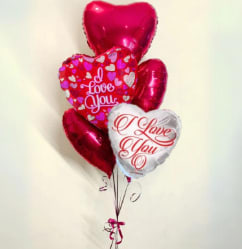 Heart-shaped Valentine balloons with "I Love You" text