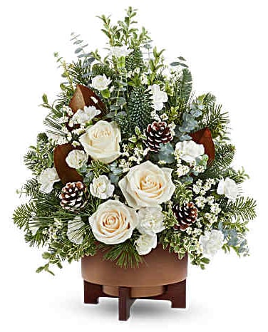 White roses and pinecones in a brown container