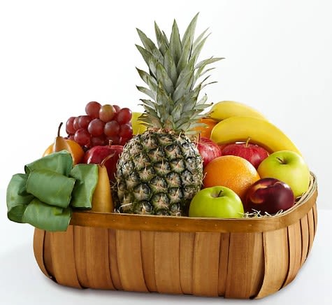 Fruit basket with pineapple, bananas, grapes, apples, and oranges