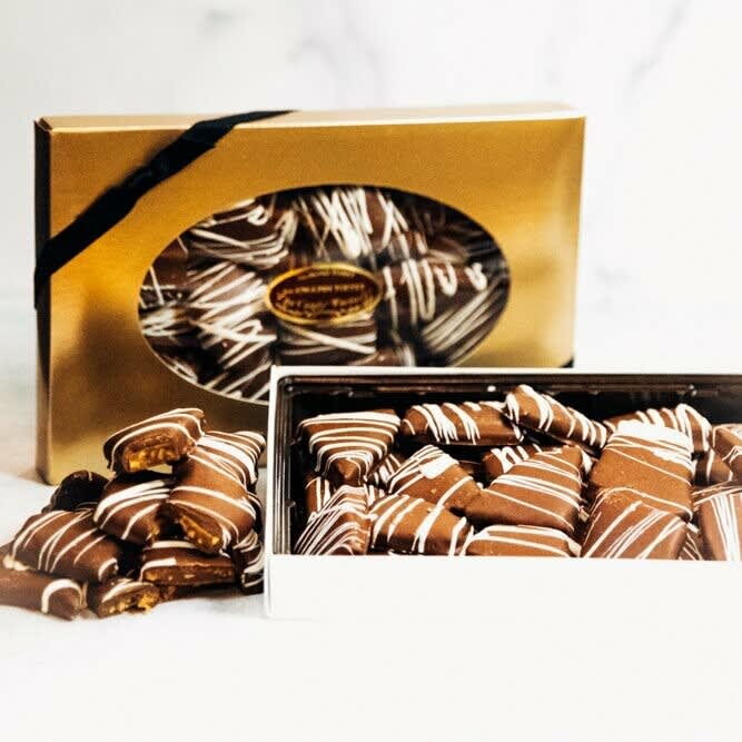 1LB Tiger Toffee Gift Box - From our local chocolatier, The Candy Factory...Rich, buttery English toffee covered in our signature milk chocolate and drizzled with white chocolate tiger stripes. *** Delicious English toffee must be ordered in addition to fresh flowers or a plant to be able to fill this request.