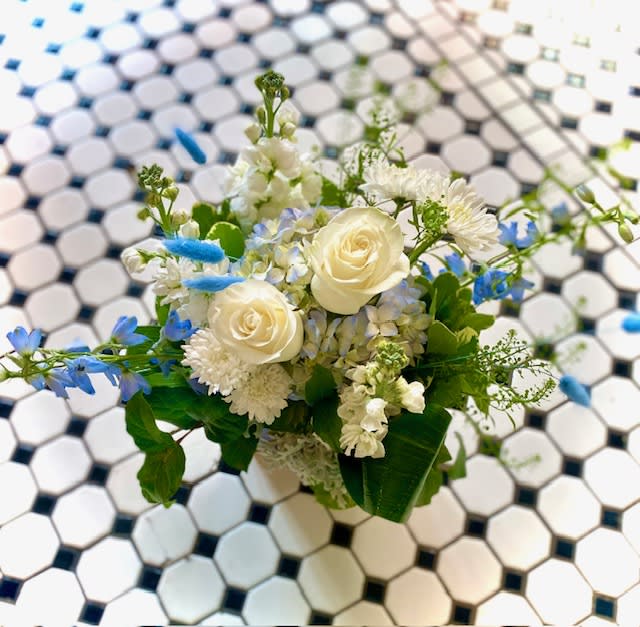 Tranquility  - Beautiful and peaceful, this mixture of blue, green and white garden flowers will bring a tranquil mood to anyone who receives this bouquet. Flowers such as roses, delphinium, iris, and hydrangea.