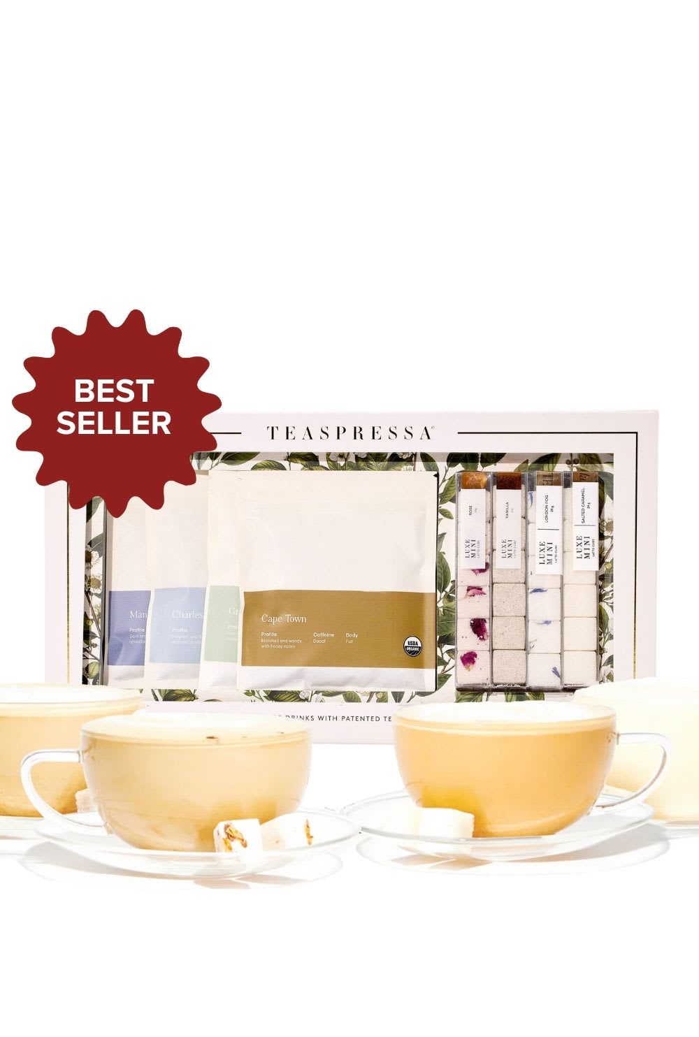 Tea gift set with cups and assorted tea packets in a boxed display