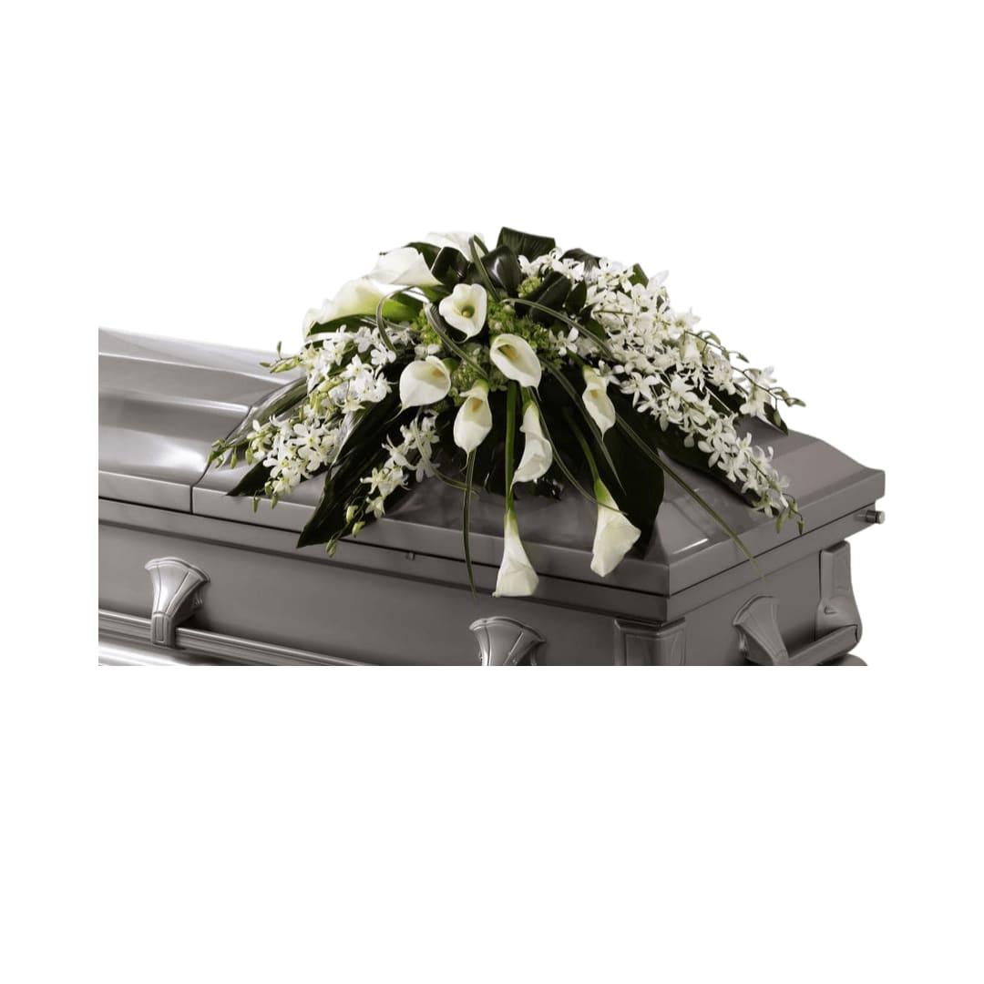 Angel Wings Casket Spray - Angel Wings Casket Spray is an exceptionally gorgeous way  to bring peace and beauty to their final farewell service. White Dendrobium orchids, white calla lilies, green hydrangea and a variety of  lush greens are artfully arranged to perfectly adorn the top of their  casket, offering the colors and ambience of grace and serenity.    