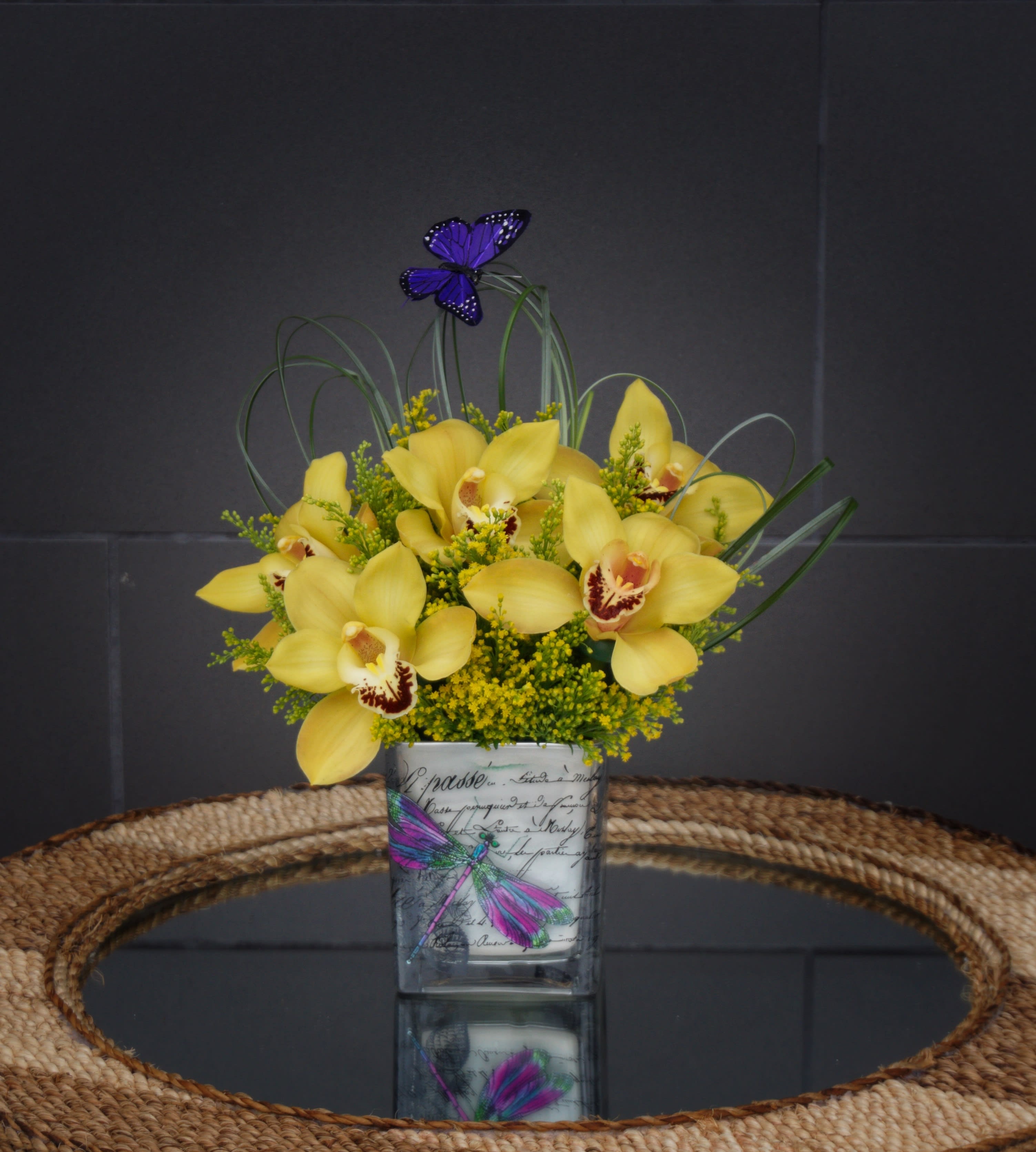 Sunshine Smile - A pretty design including cymbidium orchids and accents in a nice container. STANDARD: FIRST PHOTO DELUXE: SECOND PHOTO PREMIUM: THIRD PHOTO