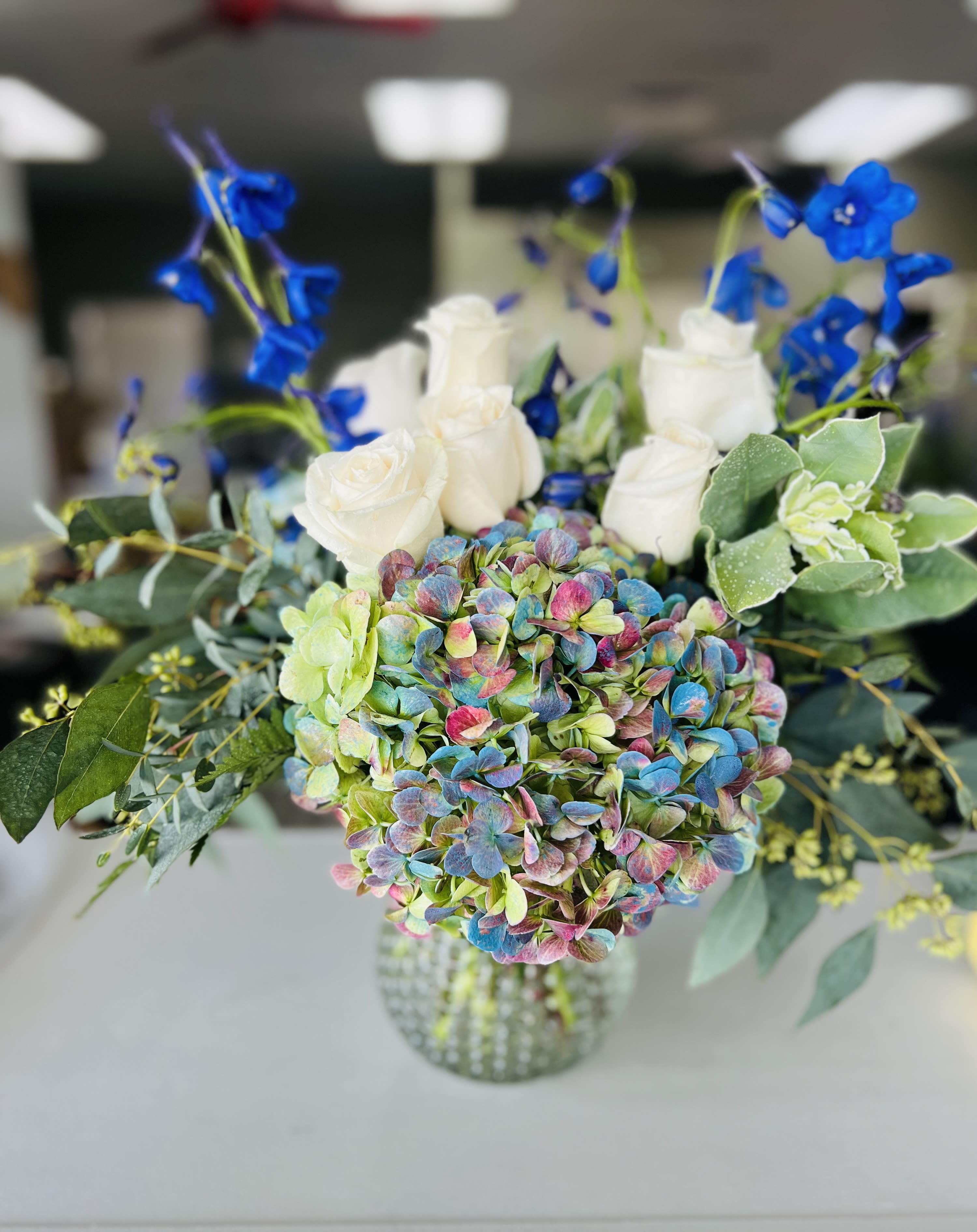 Blessing Lights  - Fresh design including hydrangea, rose, and accents in a nice container. 