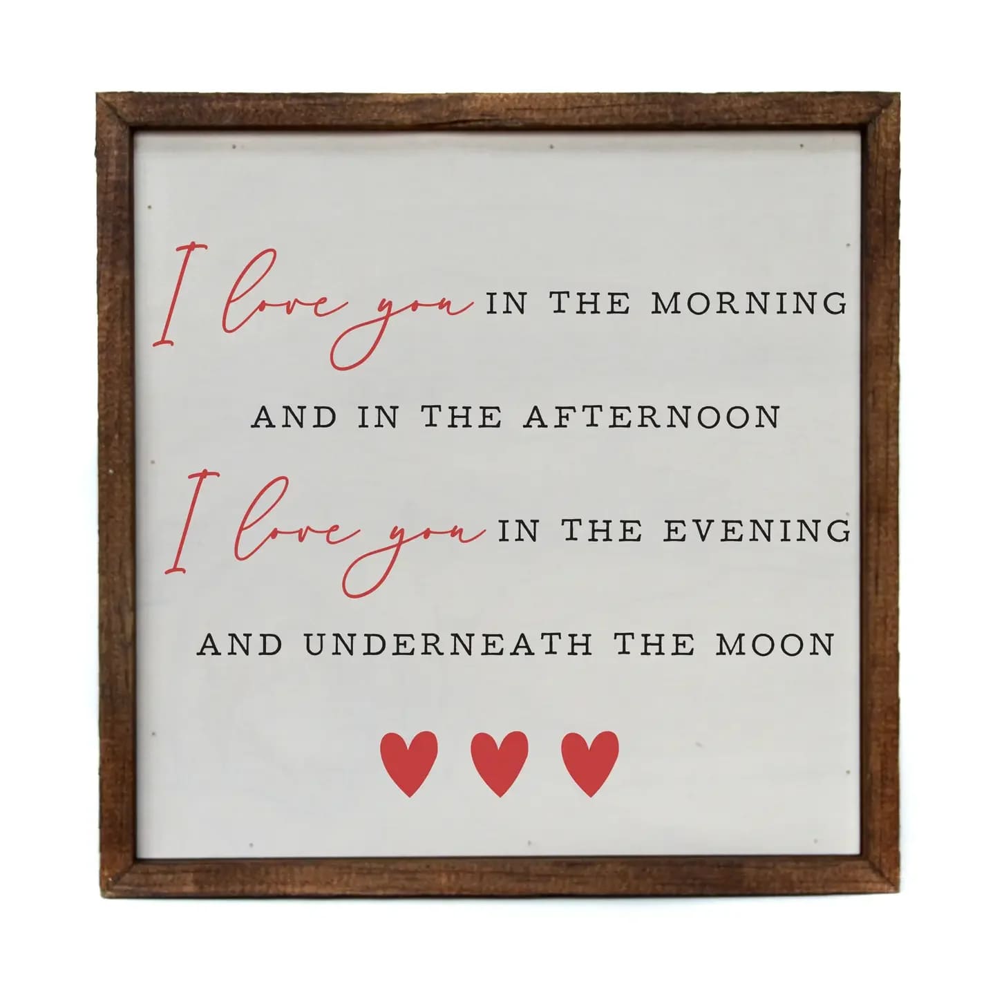 Framed sign with a love quote and three red hearts