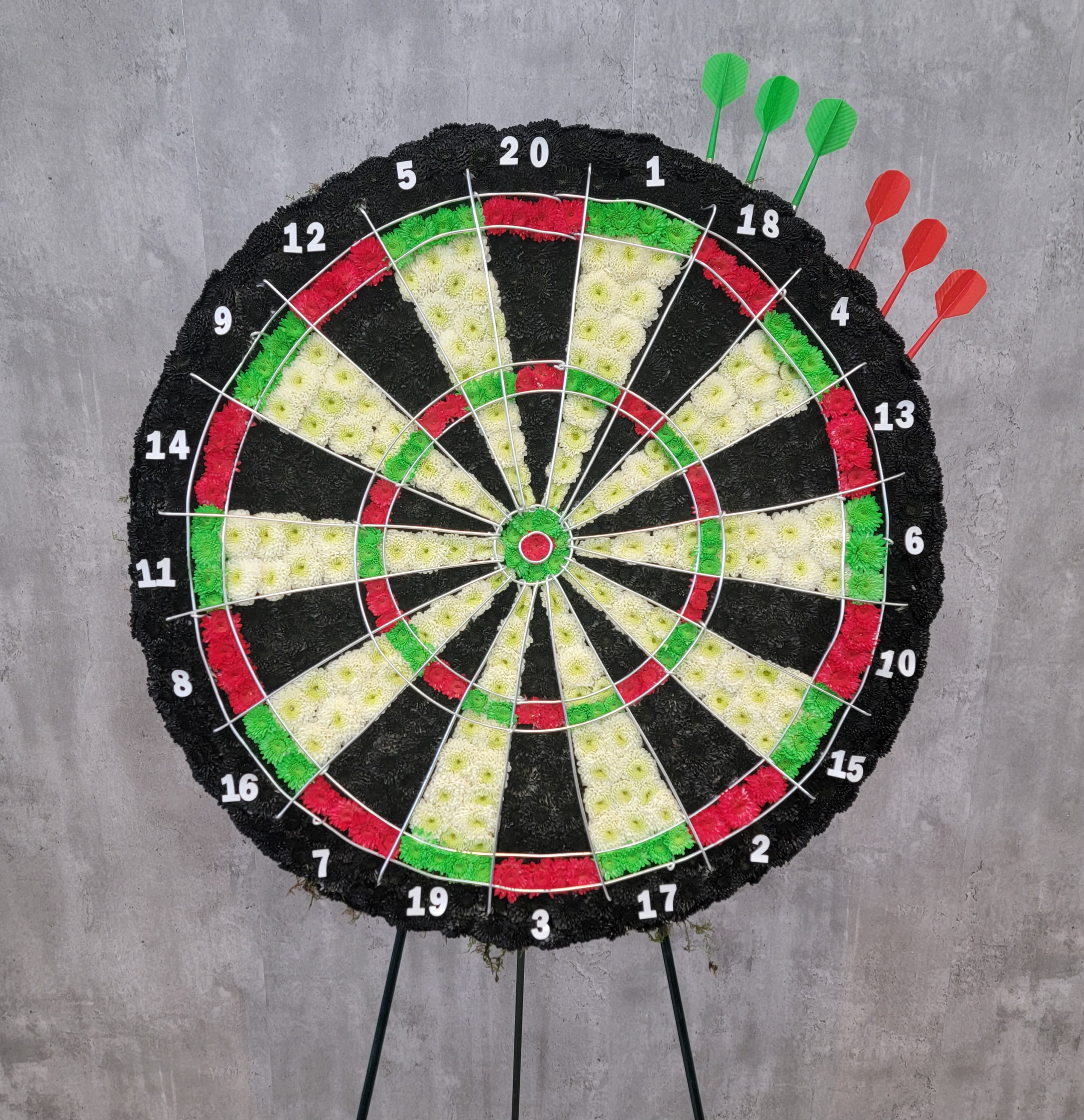 Large floral dartboard display with numbered sections and colored flower wedges