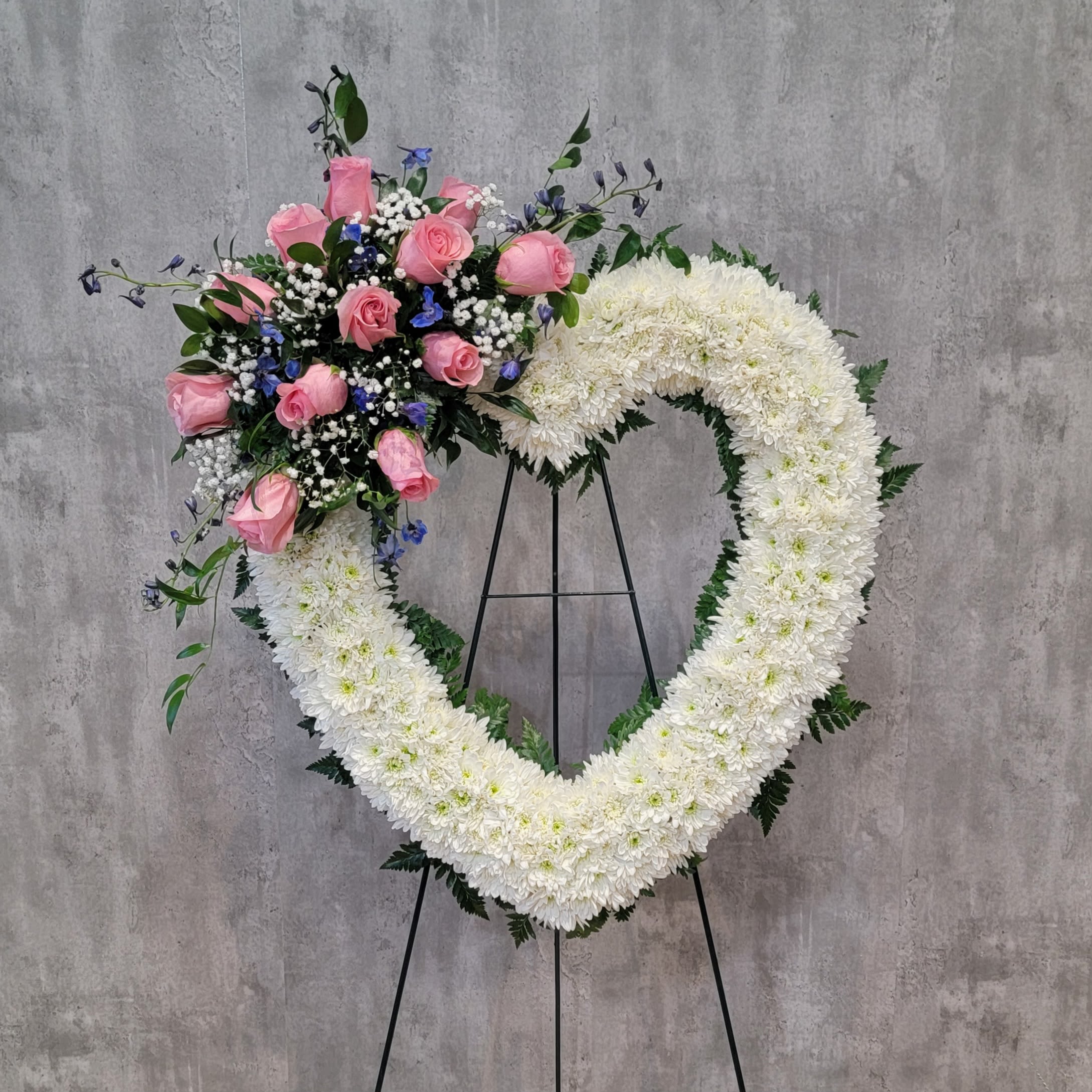Lots of Love Heart - Pay tribute to your loved one at their memorial services with the beautiful heart in shades of blues and lavenders. The heart is approximately 24" across.  Your reliable Albuquerque florist, locally owned and operated is ready to delivery your fresh flowers within Albuquerque. Flowers by Zach-Low has been serving the Albuquerque area since 1993 and offers same day flower delivery in Albuquerque. Delivering fresh flowers in Albuquerque is a passion that drives Flowers by Zach-Low to be the best Albuquerque florist in town.