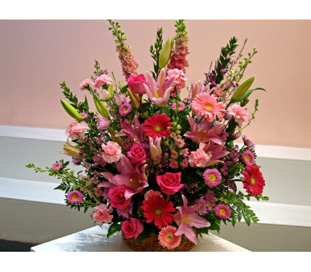 Heavenly Pink - W508 - This arrangement is suitable for sympathy and funeral ceremonies corporate events and or other large events. Heavenly Pink is a pink basket spray that's made with Roses Larkspurs Gerbera Daisies Asiatic Lilies Asters Carnations in a wicker basket. Commemorate a momentous occasion or event with Heavenly Pink designed and delivered by Fillmore Florist in San Francisco.Dimensions Approximately: 32" H x 19" W As Shown : W508
