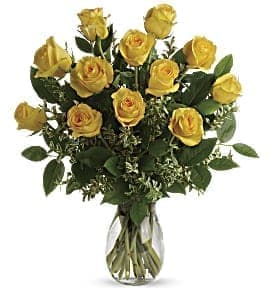Bouquet of yellow roses in a clear glass vase