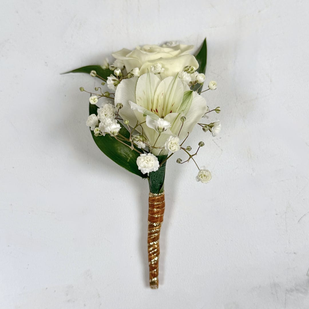 Elegant Ivory Boutonniere - Our Elegant Ivory Boutonniere puts a subtle, but exciting spin on the traditional boutonniere. Where most boutonnieres are typically made up of almost exclusively roses, this boutonniere pairs a white/cream spray rose with a white alstroemeria flower, adding a special touch that'll make your florals stand out among the rest! This boutonniere also comes wrapped in a shimmering gold ribbon for extra class, and boutonniere pins are included to help keep your florals secure while you're dancing the night away! Perfect for someone who enjoys tradition but still wants to make a statement, the Elegant Ivory Boutonniere is ready for any prom night or formal event.