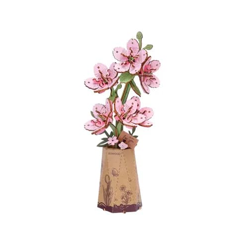 Hands Craft - Sakura Wooden 3D Puzzle - Soft, delicate, and timelessly beautiful - our Sakura (Cherry Blossom) 3D Wooden Puzzle captures the gentle elegance of spring's most iconic flower in a hands-on, calming craft experience. The finished design features soft pink petals and graceful detailing, making it a lovely accent for your desk, shelf, or windowsill - no watering or sunlight required.  Whether you're brightening up your space or gifting a symbol of renewal and beauty, this puzzle is a serene celebration of nature and creativity in bloom.  Age Range: 14+  Assembled Dimensions: 3.5 x 3 x 8.9 inches  Assembly Time: 30 minutes  Piece Count: 113 pieces
