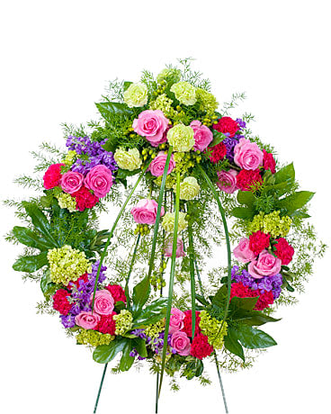 Forever Cherished Wreath - This beautiful wreath with a combination of pink and purple flowers will show that they will be forever cherished. 