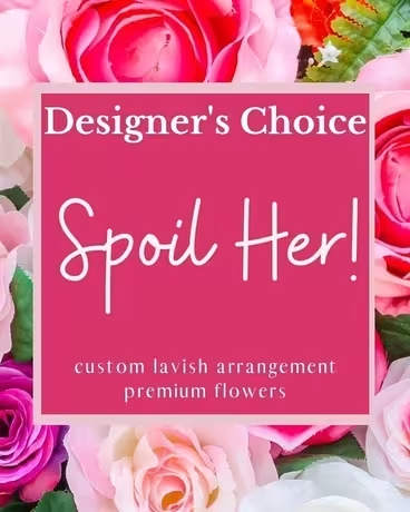 Pink designer's choice floral arrangement with roses around the border