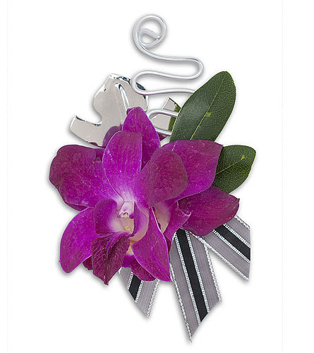 Purple orchid corsage with ribbon and silver clip