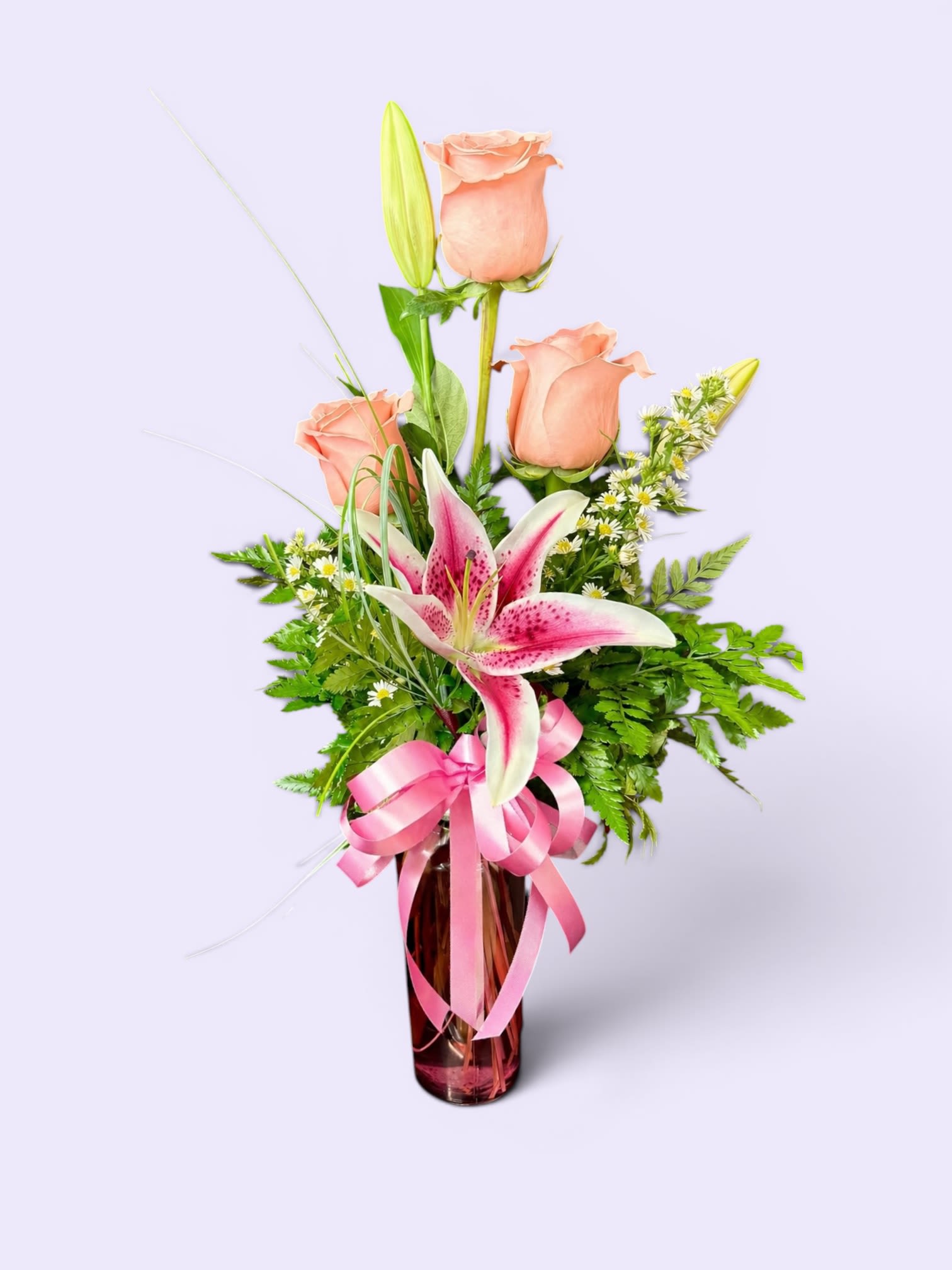 Devil's Tower Delight - This beautiful vase filled with roses and lily's will surely make mom forget your childhood tantrums!