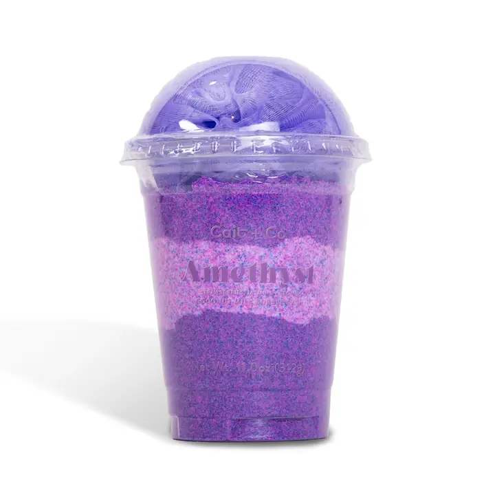 Purple bath product in a clear plastic cup with a domed lid