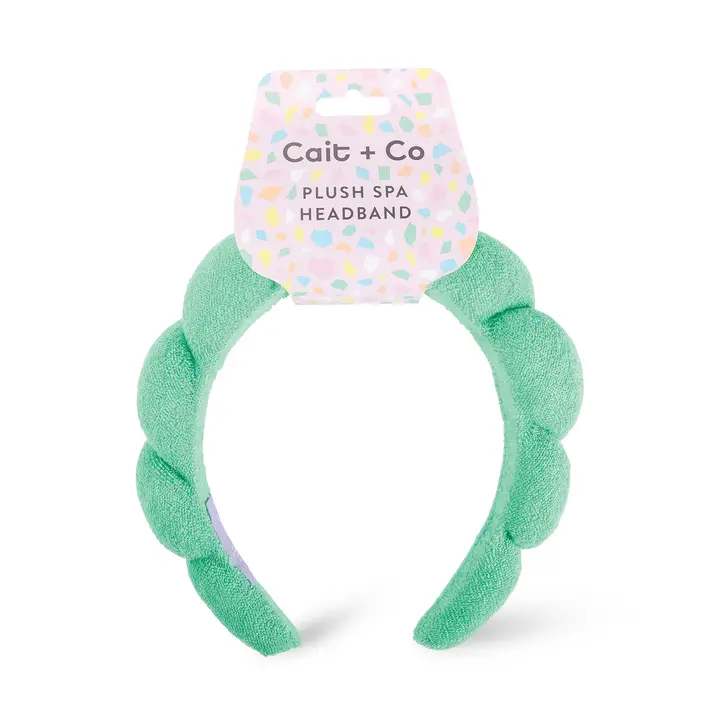 Mint green plush spa headband with a pastel Cait + Co tag