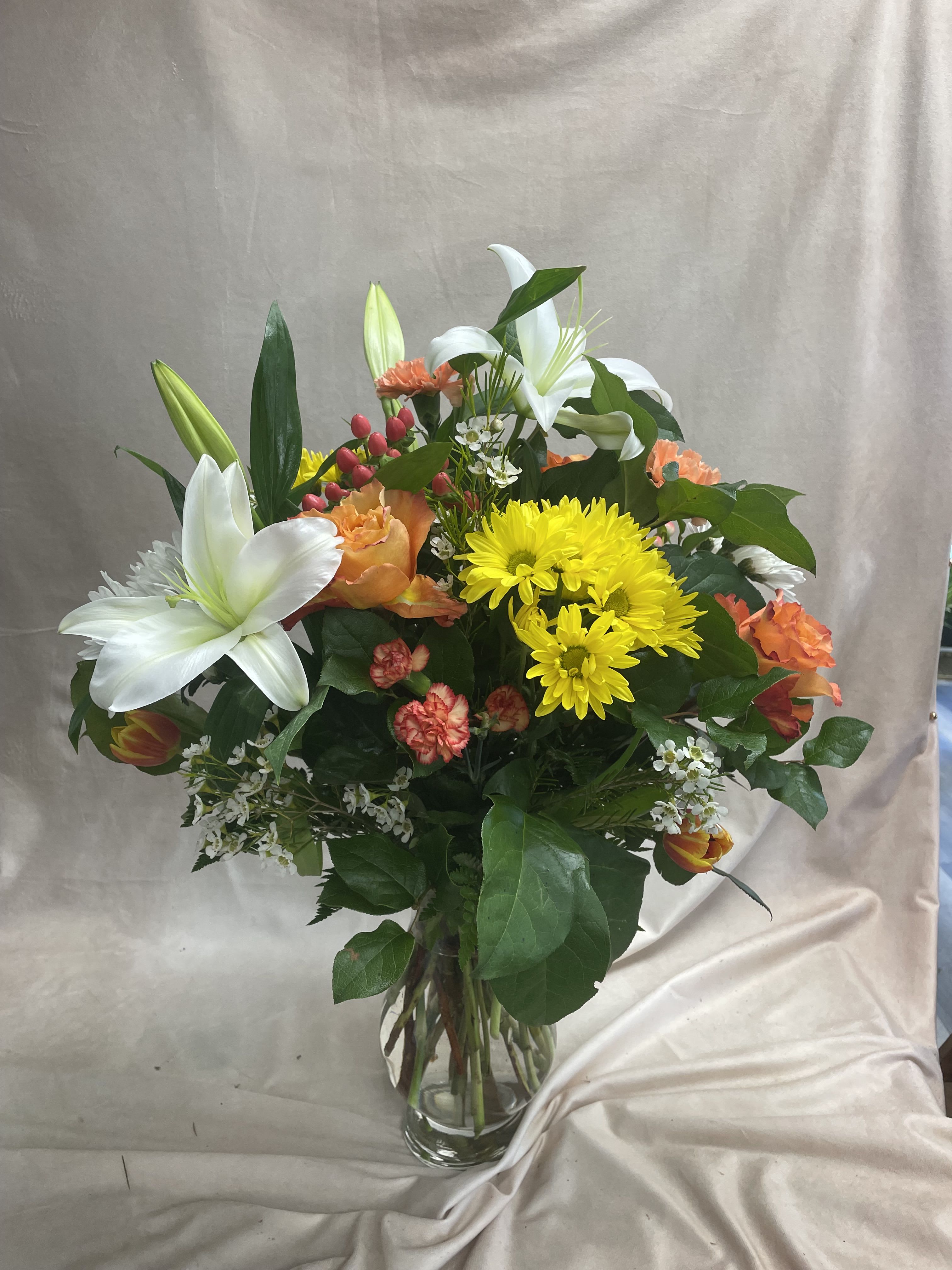 Hot Mama - Lily, Roses, Daisy, Cushion mums, Tulips, Carnations, Hypericum, and wax flowers