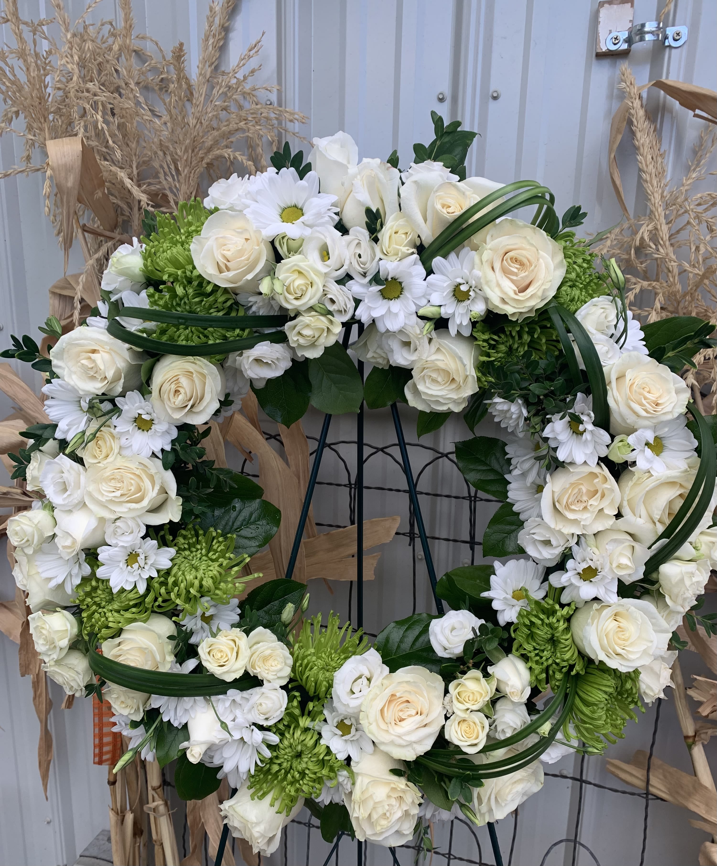 Lasting Serenity by BloomNation™  - A beautiful white and green tribute wreath that calms, this easel arrangement celebrates a full life and a peaceful passing. 