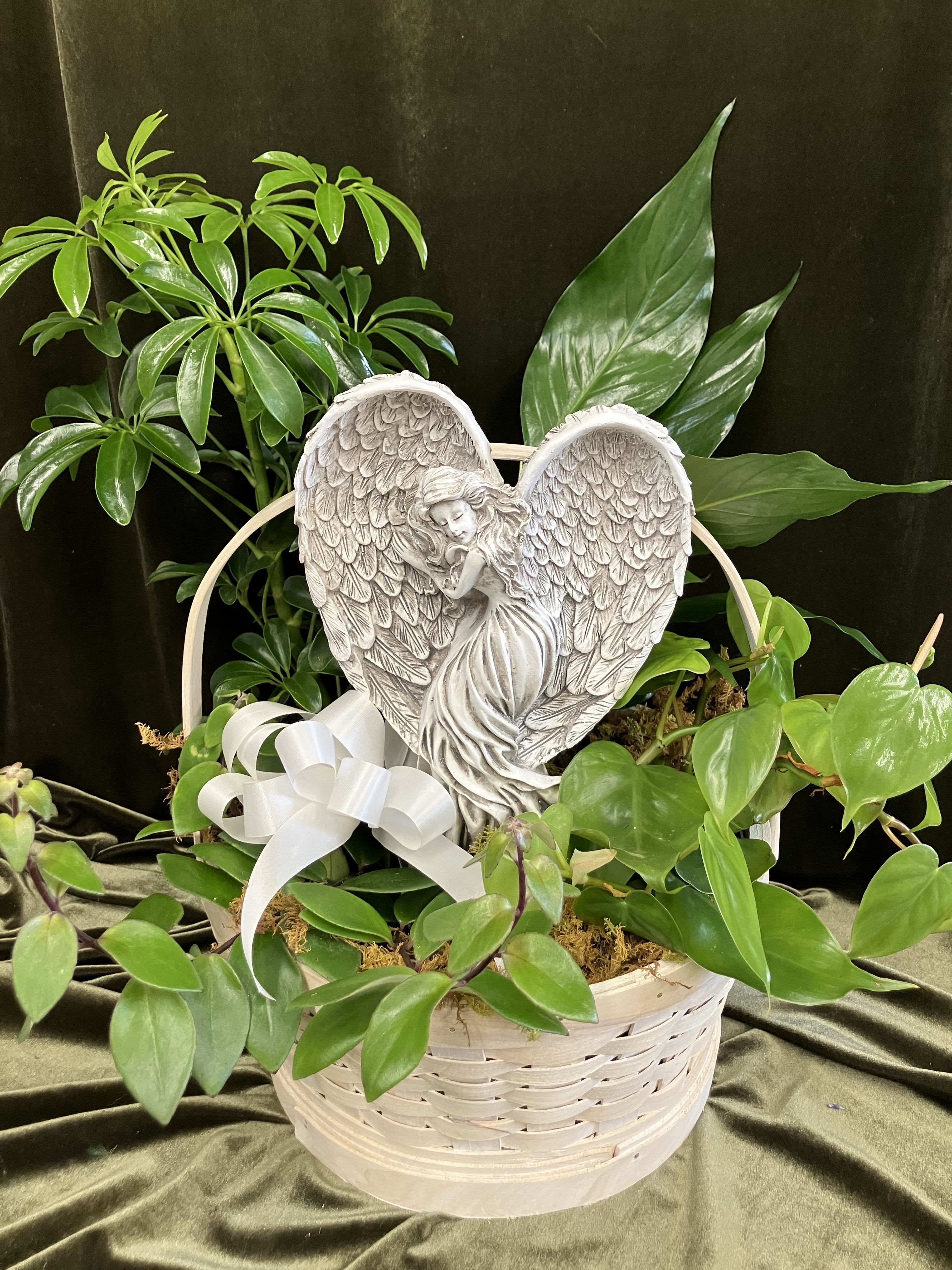 Resting Angel Planter - Beautiful green houseplants in a basket with a lovely angel surrounded with fresh, peaceful white flowers