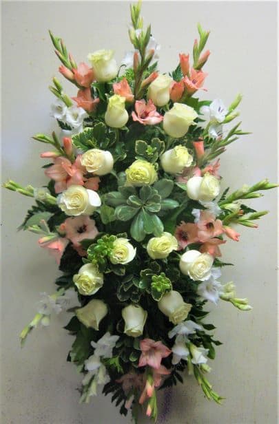 Tall floral spray with white roses and peach lilies
