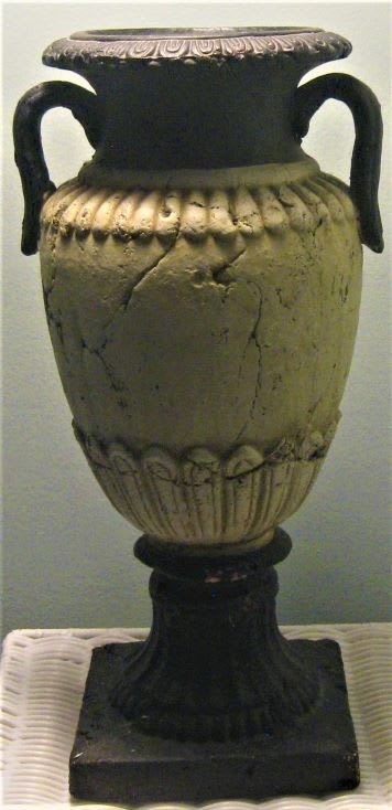 Decorative urn-shaped vase on a pedestal base