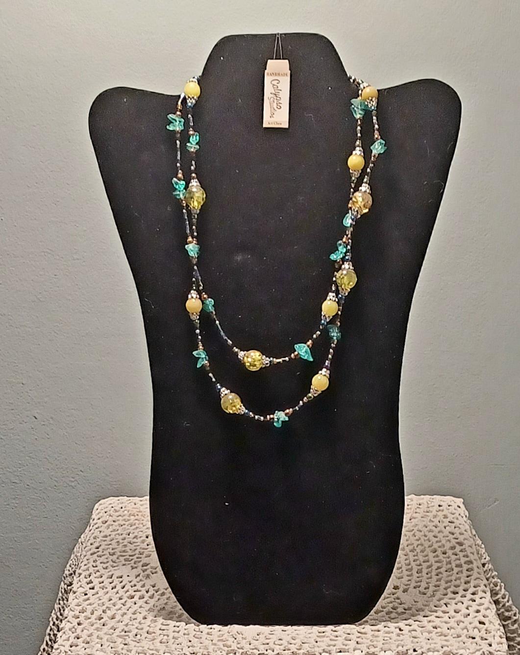 Beaded double-strand necklace on a black display bust