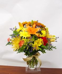 Colorful bouquet of mixed flowers in a clear vase