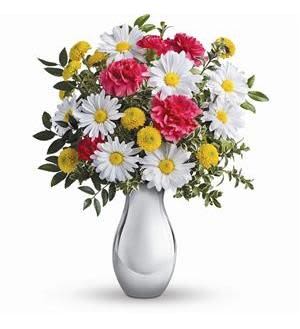 Bouquet of white daisies, pink carnations, and yellow pompons in a gray vase