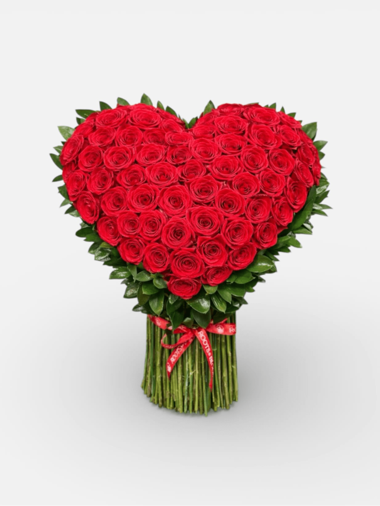 Heart-shaped bouquet of red roses with a ribbon-wrapped stem bundle
