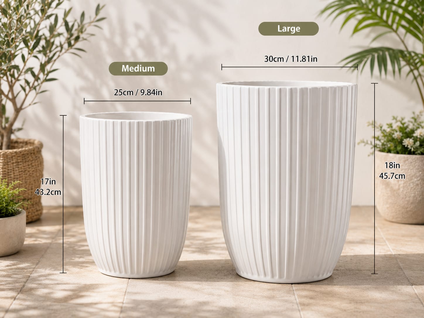 Two white ribbed ceramic planters in different sizes