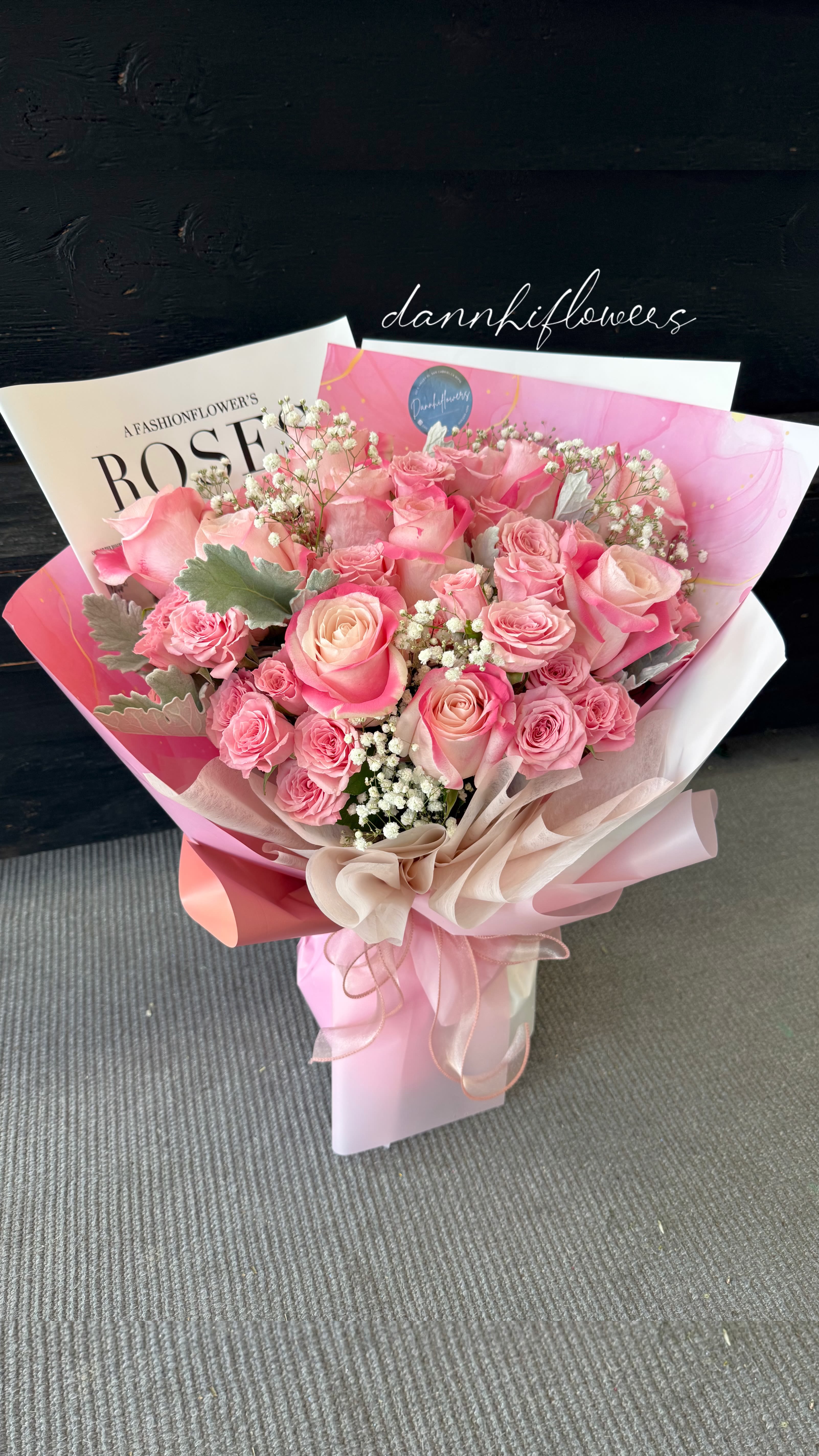 Rose Reverie - graceful blend of dusty pink bi-color roses, thoughtfully arranged to capture softness and elegance. A bouquet that feels romantic, timeless, and effortlessly beautiful.  The photo is at DELUXE size. the PREMIUM will be added more flower for bigger size. 