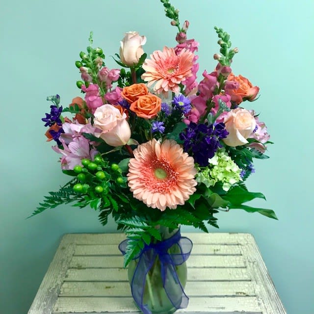 Peachy Keen E52 - This pretty pastel mix of florals will leave anyone feeling peachy keen! Upgrading to a Deluxe or Premium bouquet will add more flowers to the arrangement.
