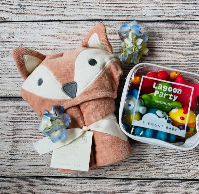 Fox-shaped baby blanket with a clear pouch of colorful toys
