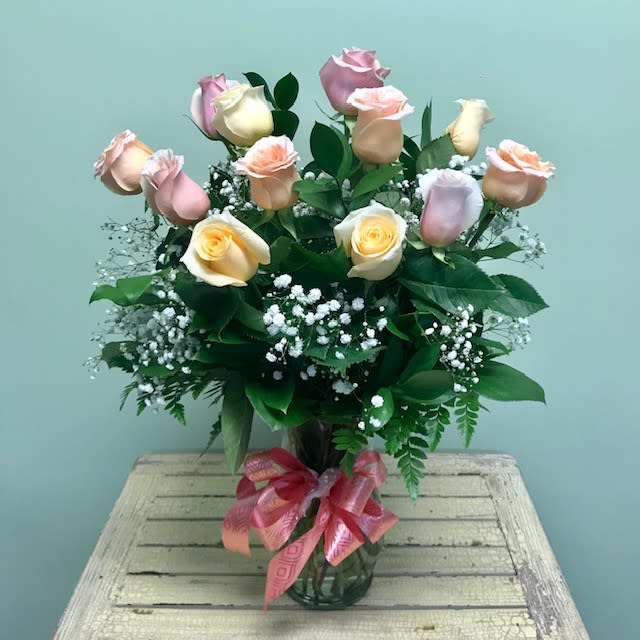 Assorted Dozen V-06 - Send a message that shows all of your true feelings with a vase full of assorted colored roses, accent blooms, foliages made complete with a charming bow